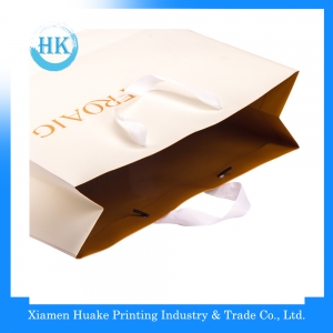 Promotional hot selling brand ribbon handle paper bag 